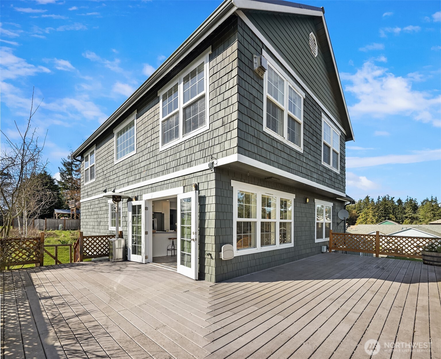 1316 East Backswing Lane Freeland, WA 98249 - Photo 1 of 34 a front view of a house with a yard