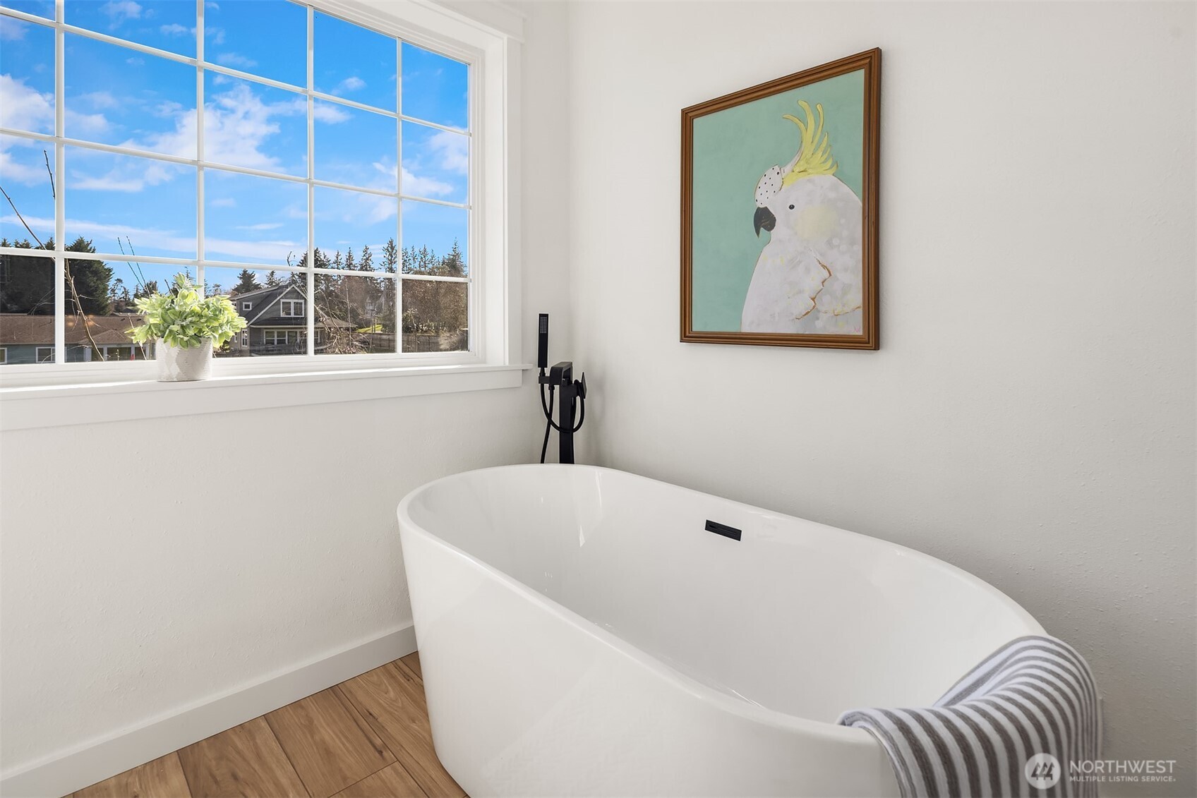 1316 East Backswing Lane Freeland, WA 98249 - Photo 27 of 34 a white bath tub sitting next to a small window
