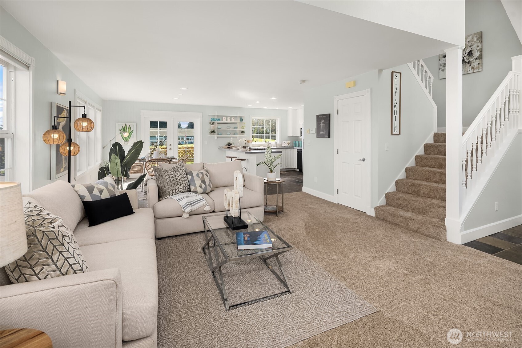 1316 East Backswing Lane Freeland, WA 98249 - Photo 10 of 34 a living room with furniture and a painting on the wall