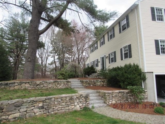 60 Raymond Road Sudbury, MA 01776 - Photo 3 of 21 a backyard of a house with lots of green space