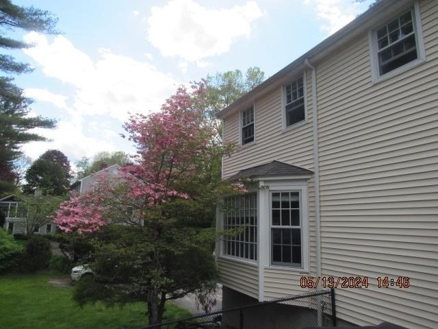 60 Raymond Road Sudbury, MA 01776 - Photo 4 of 21 a front view of a house with a yard