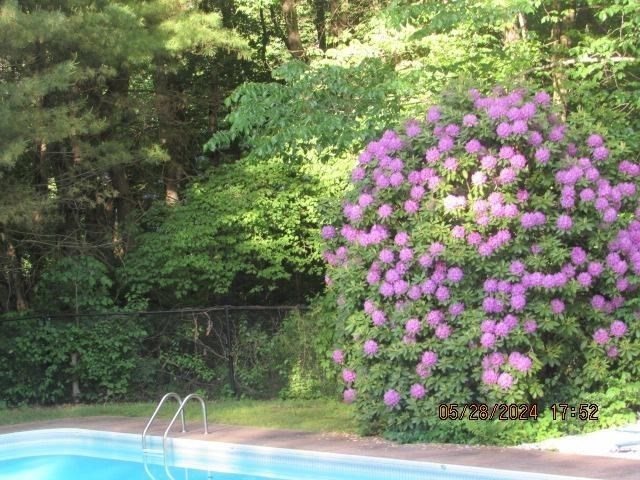 60 Raymond Road Sudbury, MA 01776 - Photo 5 of 21 a small yard with fountain and flowers