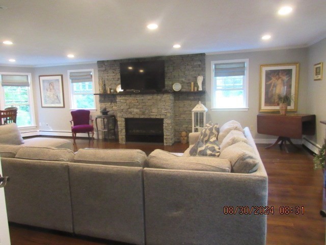 60 Raymond Road Sudbury, MA 01776 - Photo 8 of 21 a living room with furniture and a fireplace