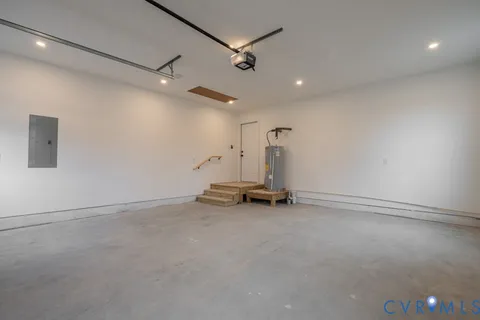 an empty room with a ceiling fan and window
