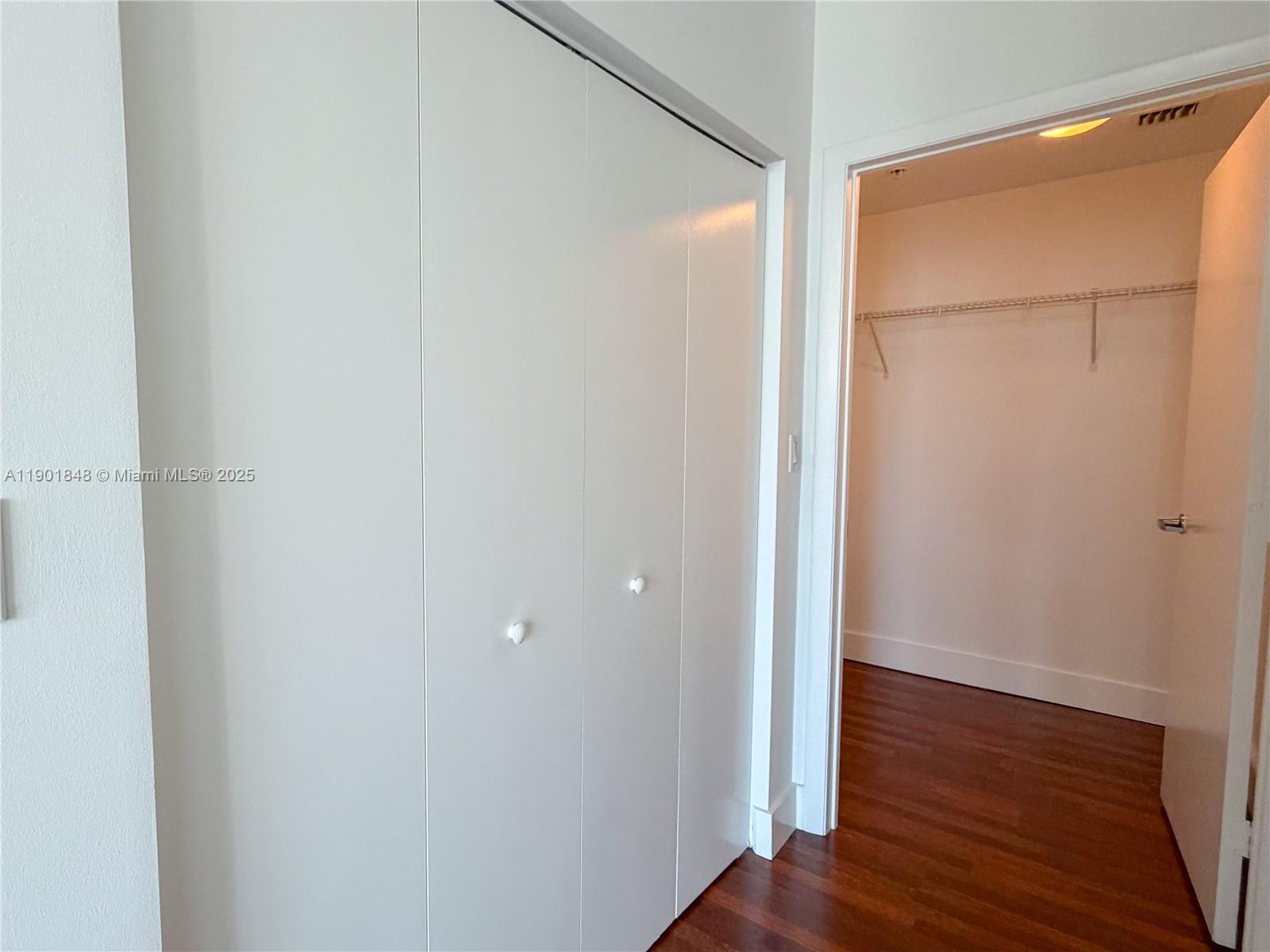 90 Southwest 3rd Street, Unit 2401 Miami, FL 33130 - Photo 22 of 68 a view of closet area with wooden floor