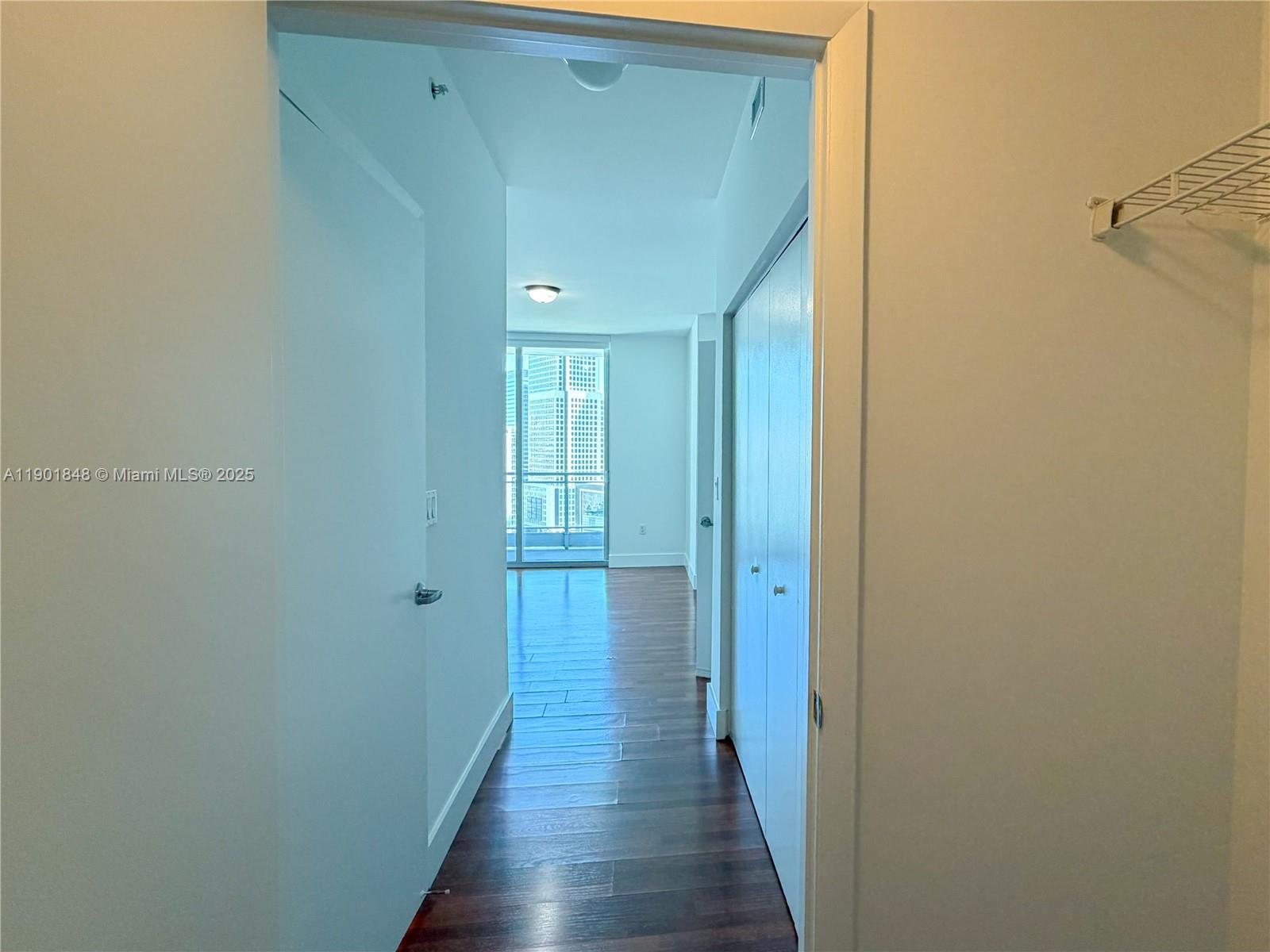 90 Southwest 3rd Street, Unit 2401 Miami, FL 33130 - Photo 24 of 68 a view of a hallway with wooden floor