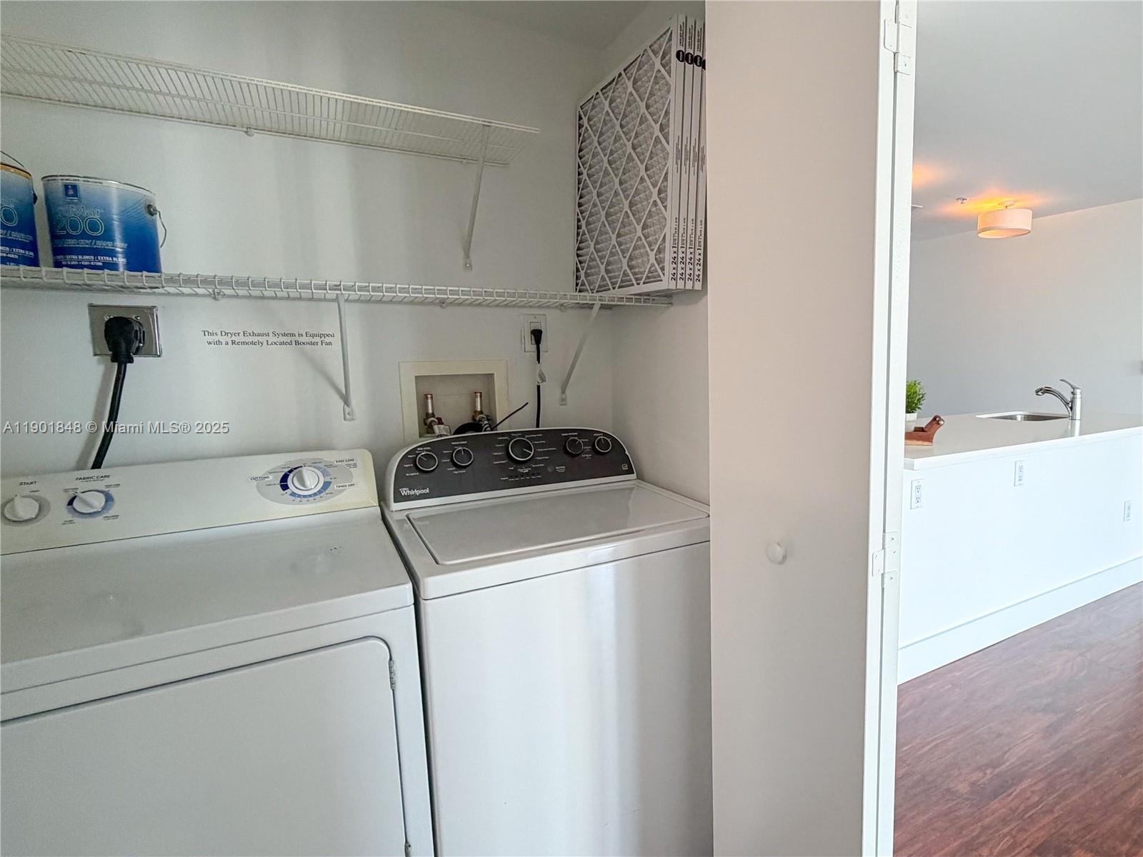 90 Southwest 3rd Street, Unit 2401 Miami, FL 33130 - Photo 36 of 68 a view of storage and utility room with washer and dryer