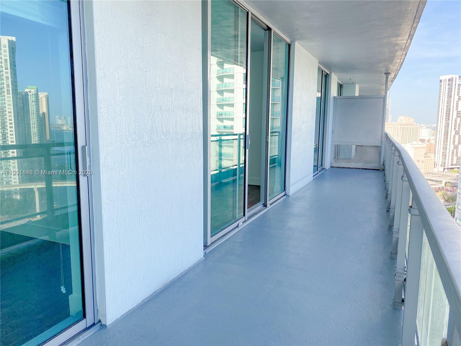 90 Southwest 3rd Street, Unit 2401 Miami, FL 33130 - Photo 45 of 68 a view of a hallway with furniture and a window