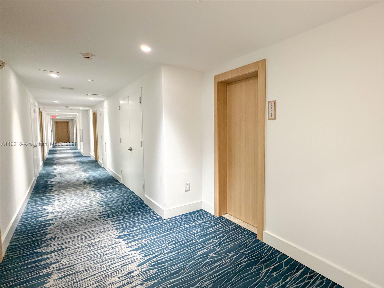 90 Southwest 3rd Street, Unit 2401 Miami, FL 33130 - Photo 51 of 68 a view of a hallway with wooden floor