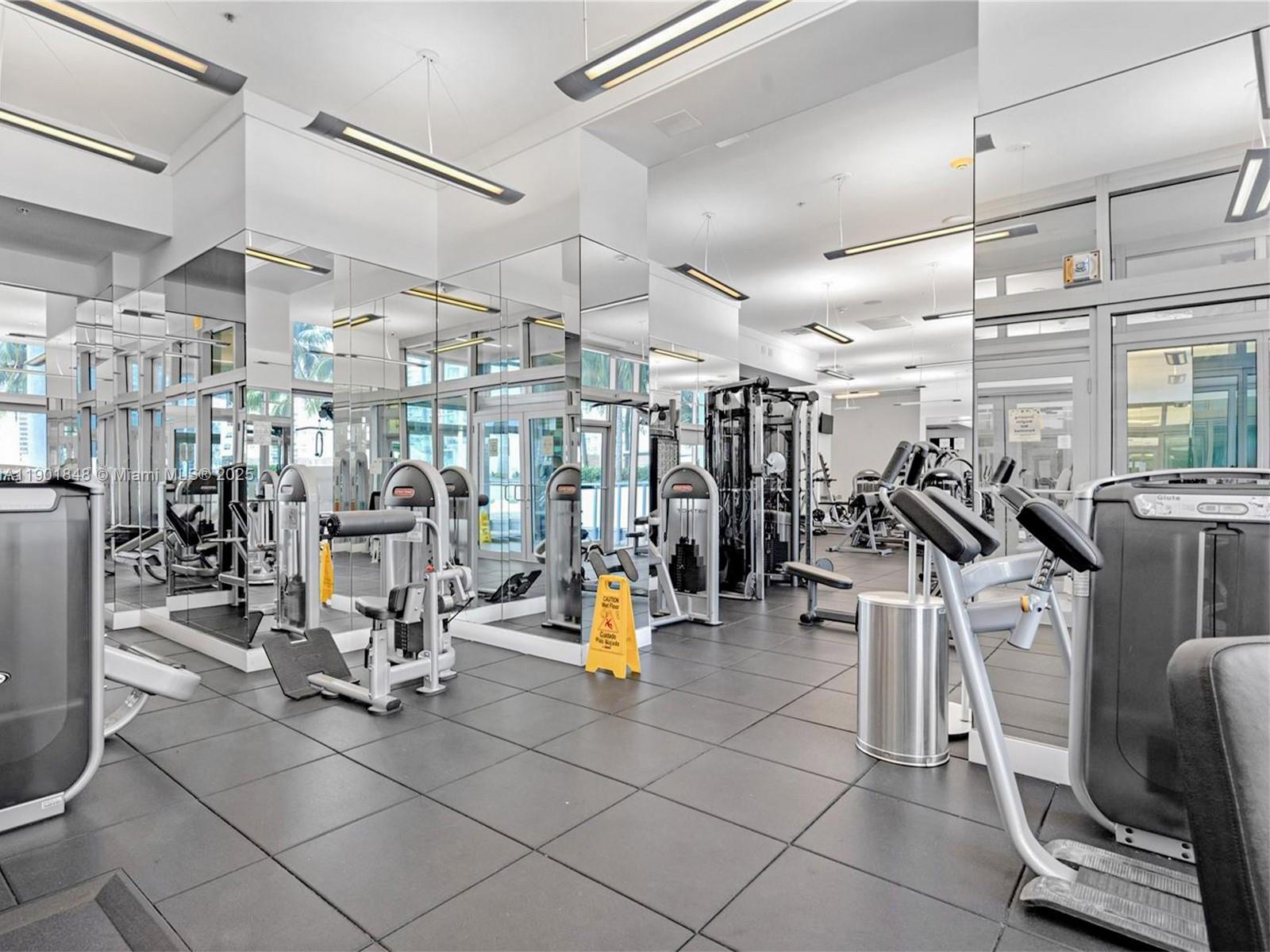 90 Southwest 3rd Street, Unit 2401 Miami, FL 33130 - Photo 55 of 68 a view of a room with gym equipment