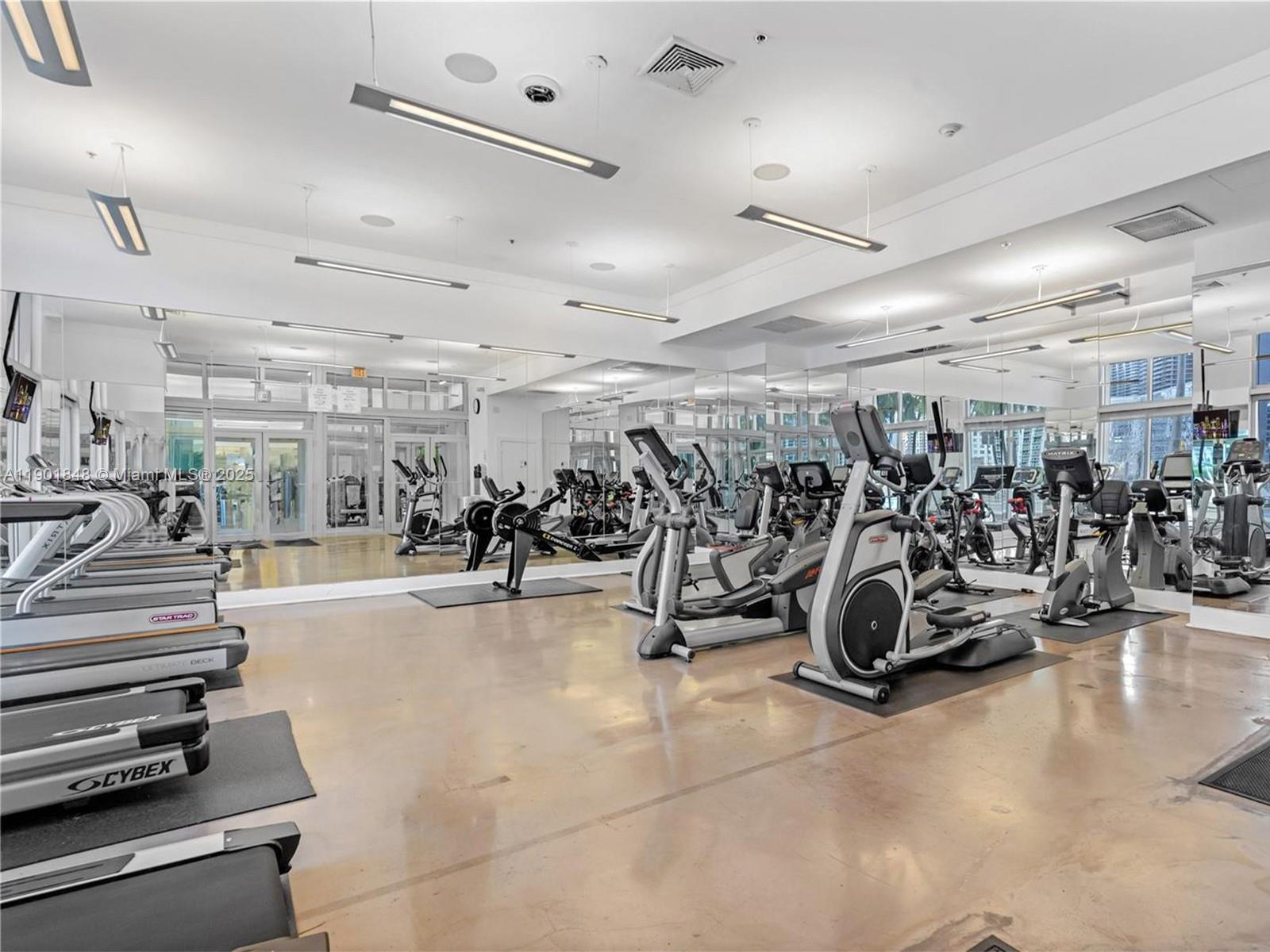90 Southwest 3rd Street, Unit 2401 Miami, FL 33130 - Photo 56 of 68 a view of a gym with lots of gym equipment