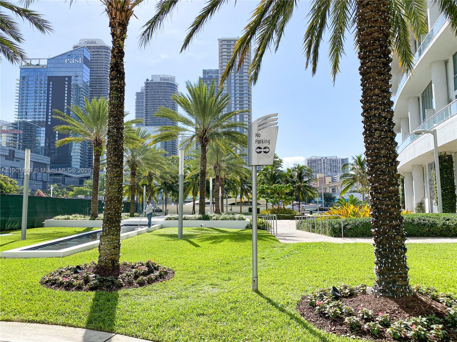 90 Southwest 3rd Street, Unit 2401 Miami, FL 33130 - Photo 57 of 68 a swimming pool with lots of tress in front of it