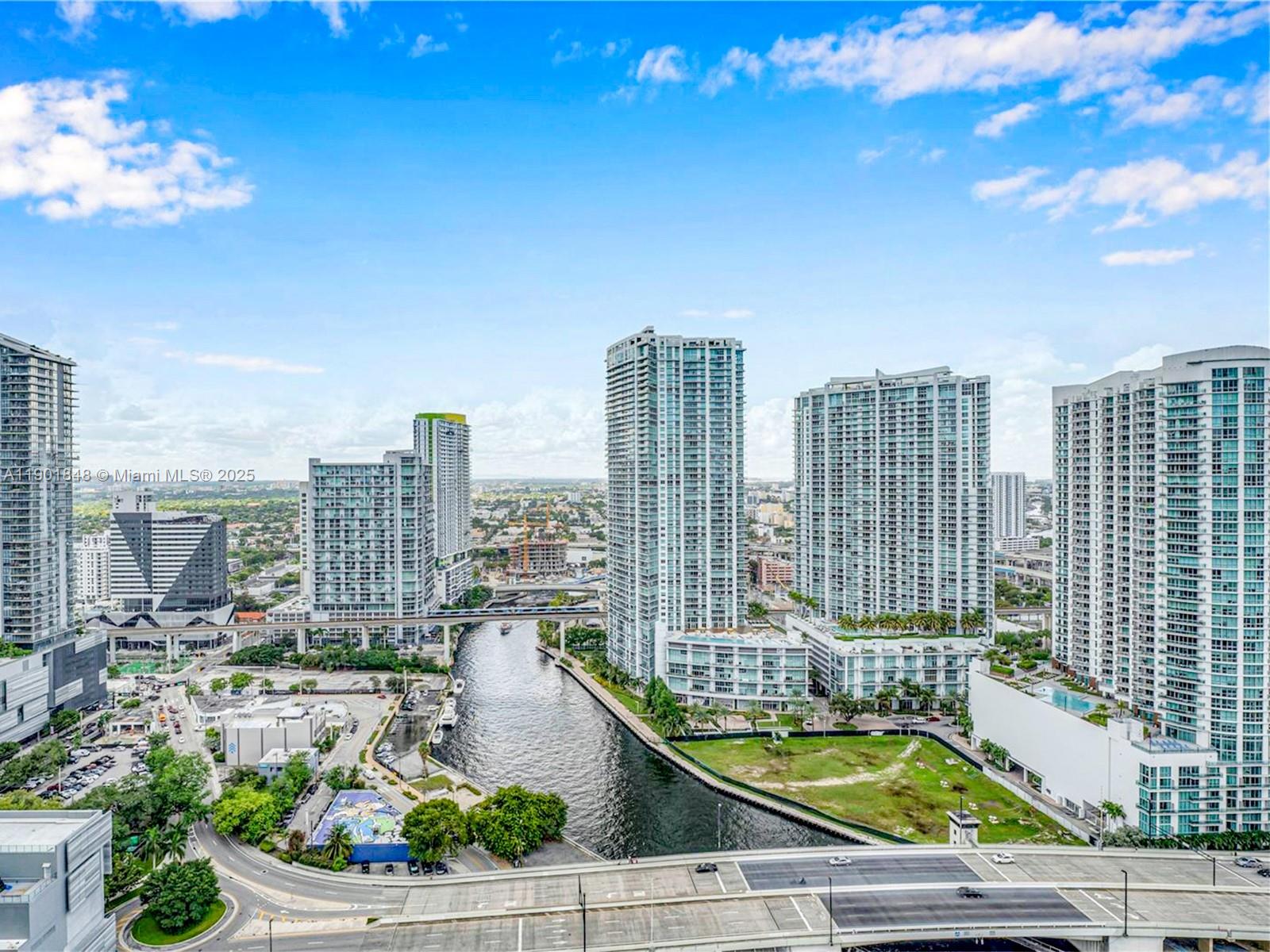 90 Southwest 3rd Street, Unit 2401 Miami, FL 33130 - Photo 67 of 68 a view of a city with tall buildings