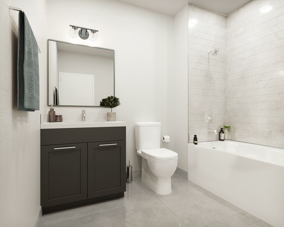 202 Maverick Street, Unit 106 Boston, MA 02128 - Photo 6 of 17 a bathroom with a sink and a mirror