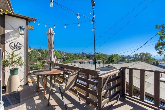 a view of a patio with a table under an umbrella