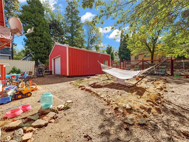 a view of a backyard of the house