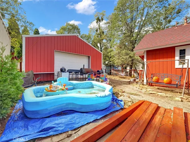 a wooden bench sitting in front of a building