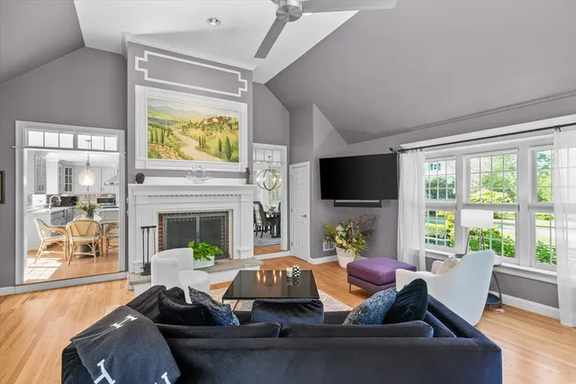 a living room with furniture fireplace and a flat screen tv