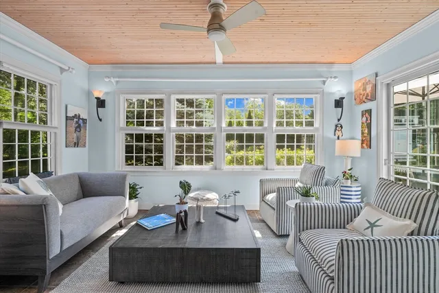 a living room with furniture and windows