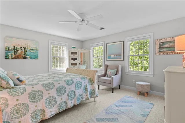 a bedroom with a large bed and a window