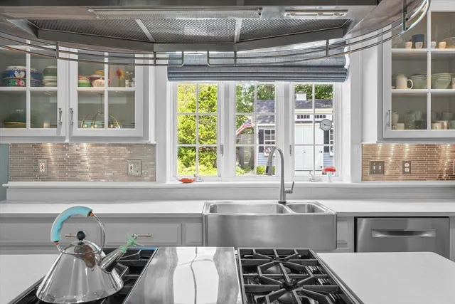 a kitchen with a sink and a window