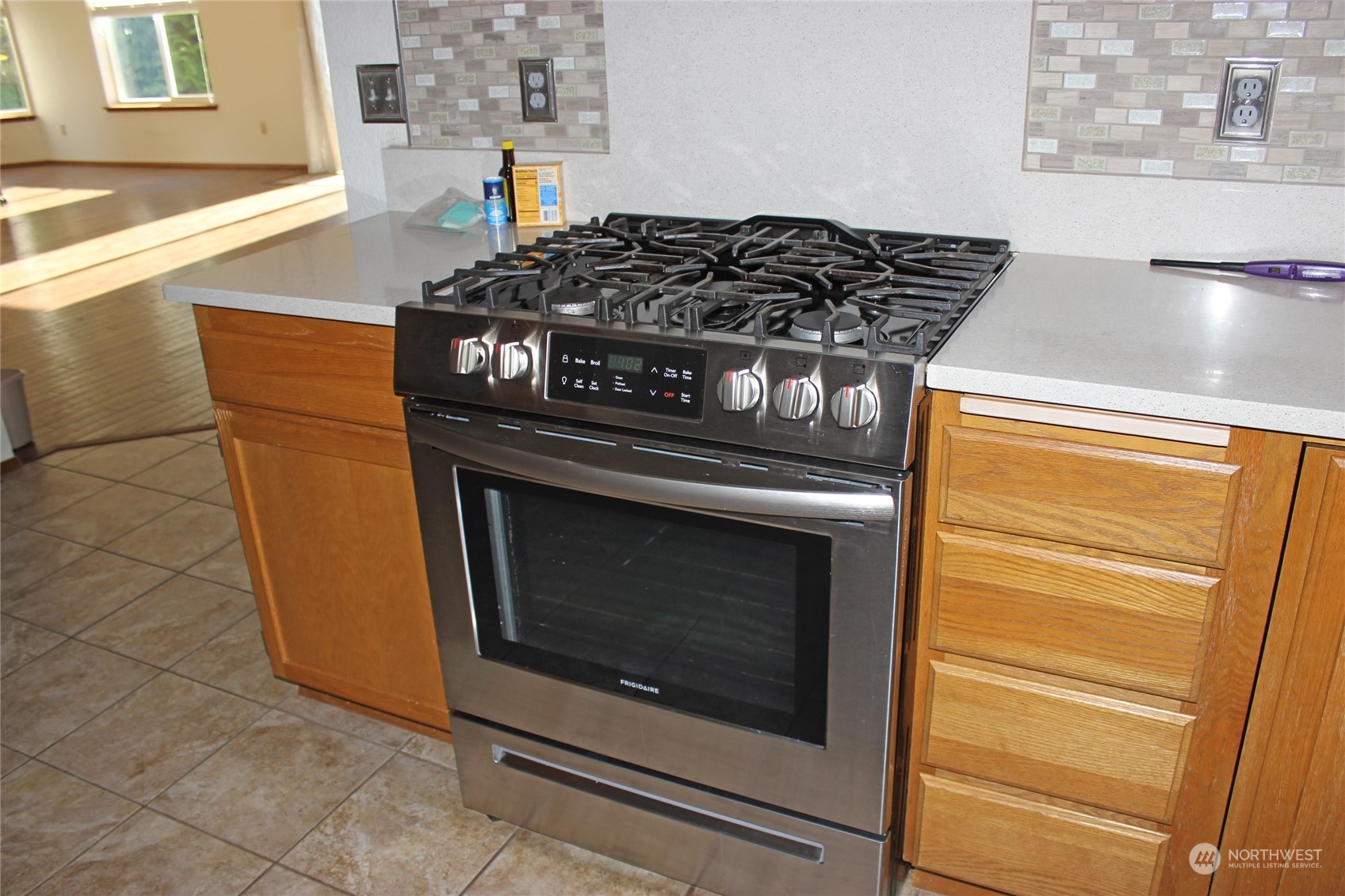 9441 Gastaeson Lane Southwest Rochester, WA 98579 - Photo 16 of 40 a stove top oven sitting inside of a kitchen