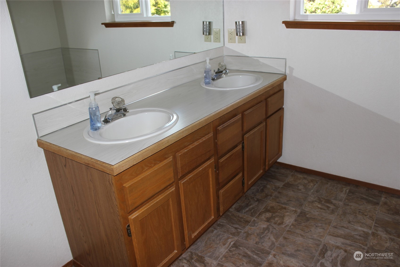 9441 Gastaeson Lane Southwest Rochester, WA 98579 - Photo 24 of 40 a bathroom with a sink and a mirror