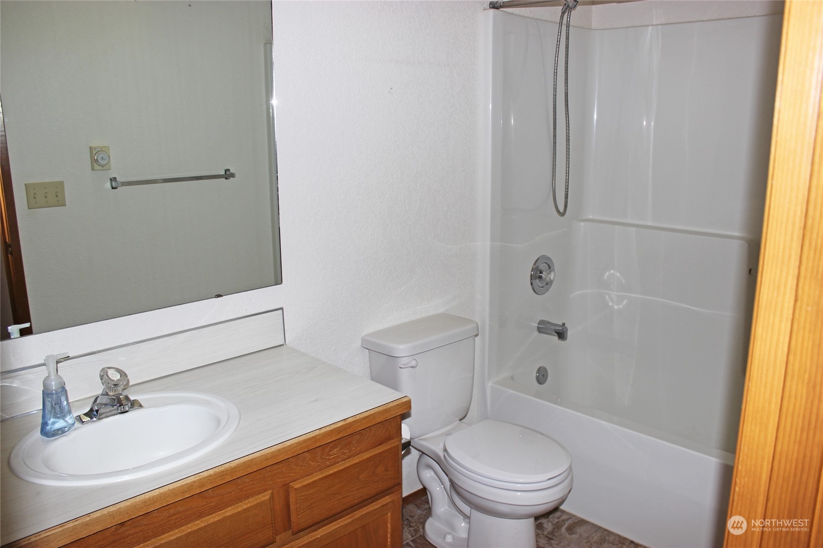 9441 Gastaeson Lane Southwest Rochester, WA 98579 - Photo 26 of 40 a bathroom with a sink a toilet and shower