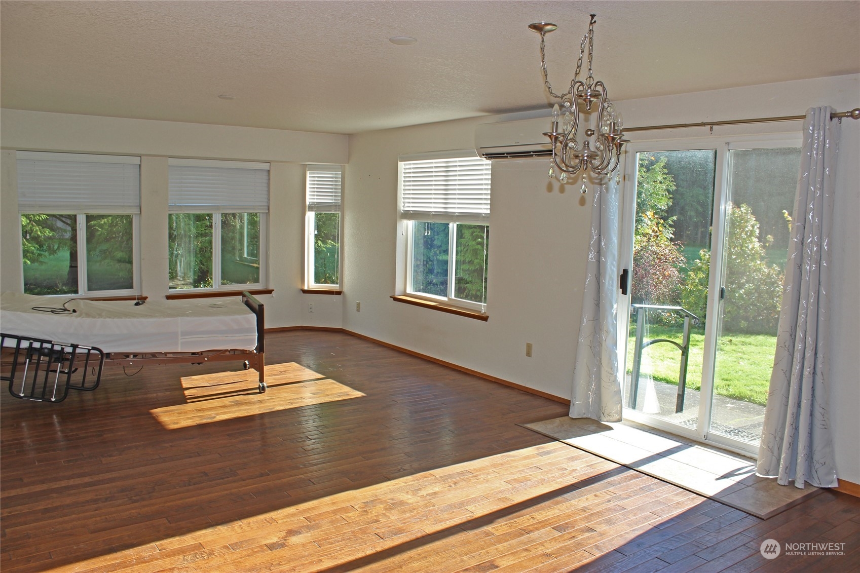 9441 Gastaeson Lane Southwest Rochester, WA 98579 - Photo 28 of 40 a view of a room with wooden floor and windows