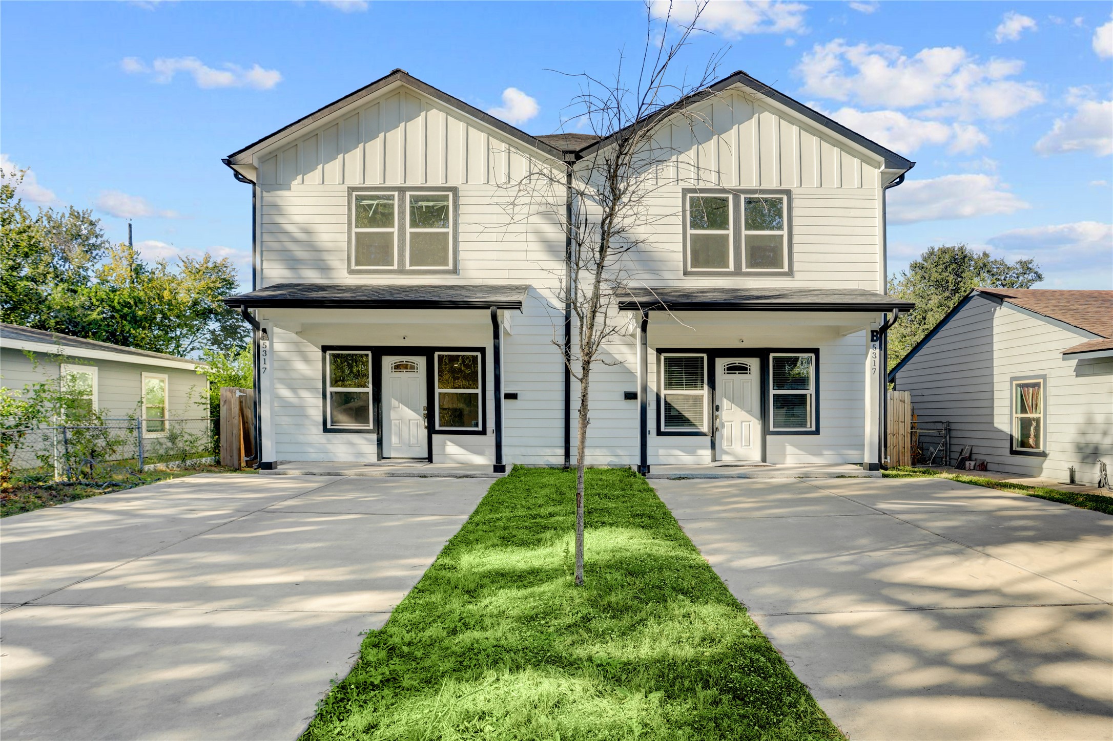 5317 Chennault Road, Unit A / B Houston, TX 77033 - Photo 1 of 27 a front view of a house with a yard