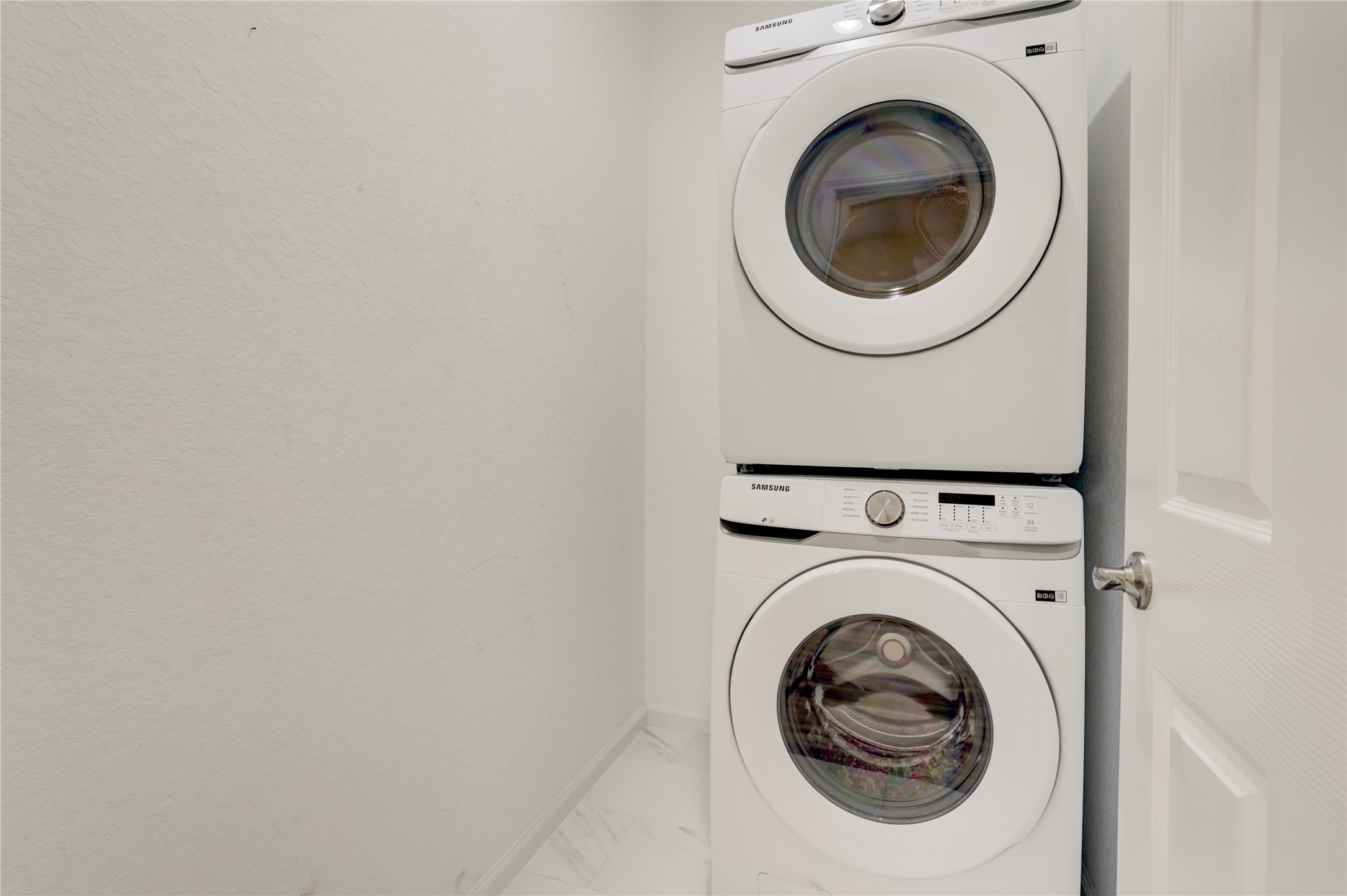 5317 Chennault Road, Unit A / B Houston, TX 77033 - Photo 15 of 27 a close up view of a washer and dryer