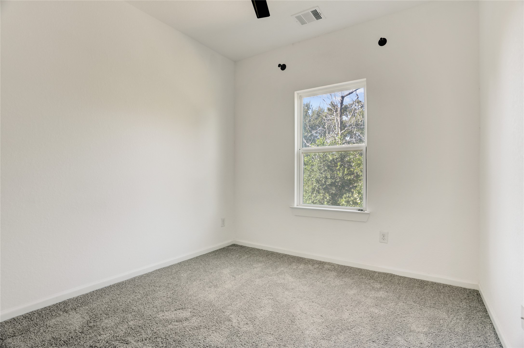 5317 Chennault Road, Unit A / B Houston, TX 77033 - Photo 21 of 27 an empty room with a window