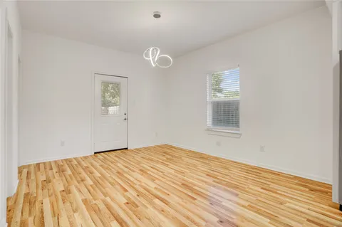 a kitchen with stainless steel appliances granite countertop a sink dishwasher stove top oven and refrigerator