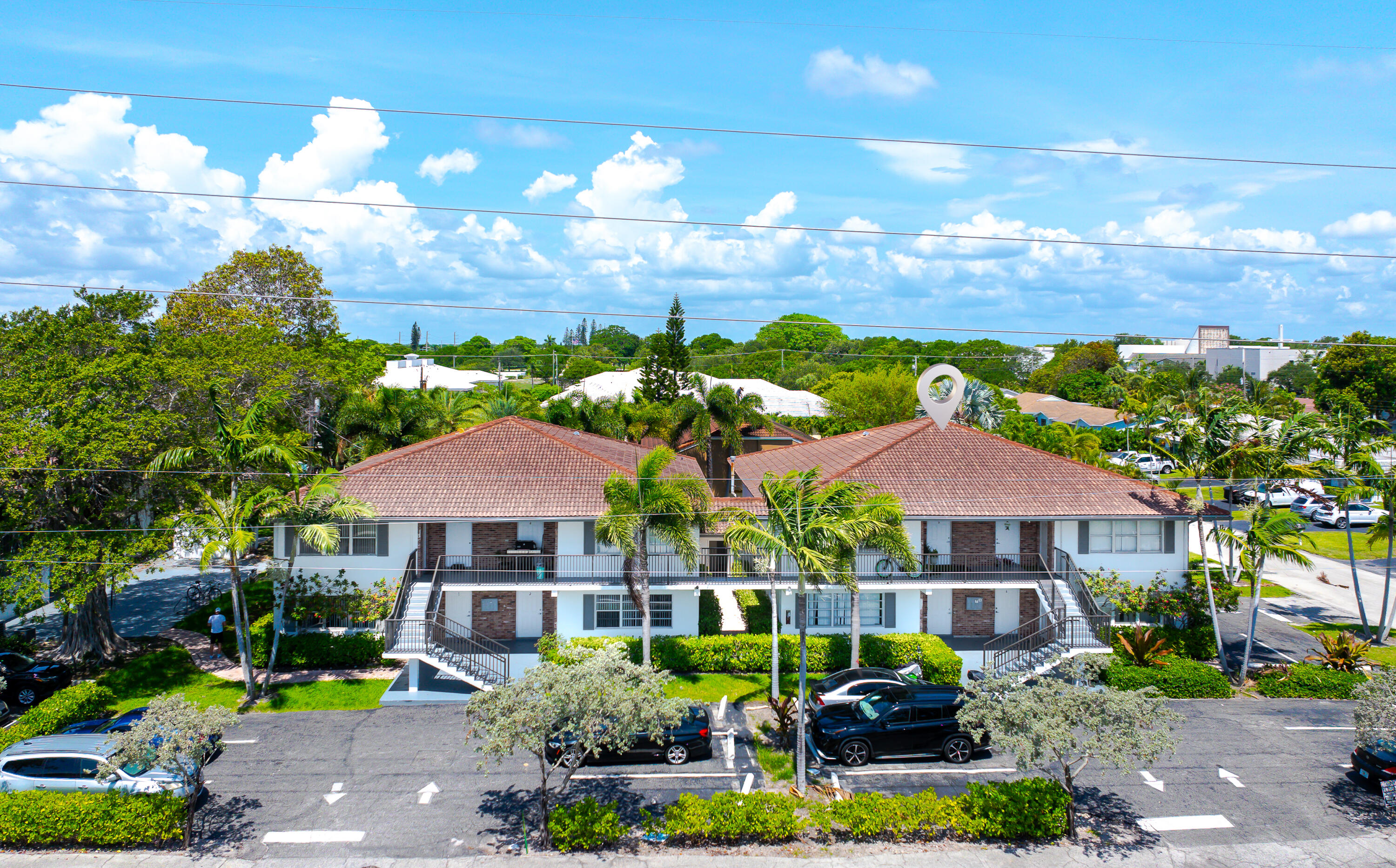 601 Southwest 2nd Avenue, Unit 5 Boca Raton, FL 33432 - Photo 1 of 26 a view of a big house with swimming pool and a yard