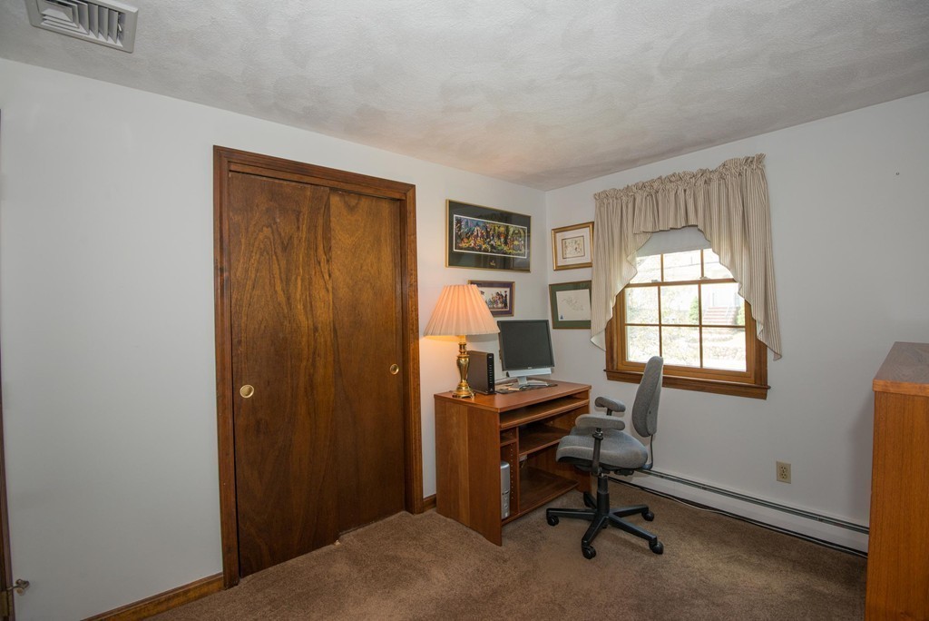 132 Spring Street Stoneham, MA 02180 - Photo 19 of 30 a view of a workspace with a window