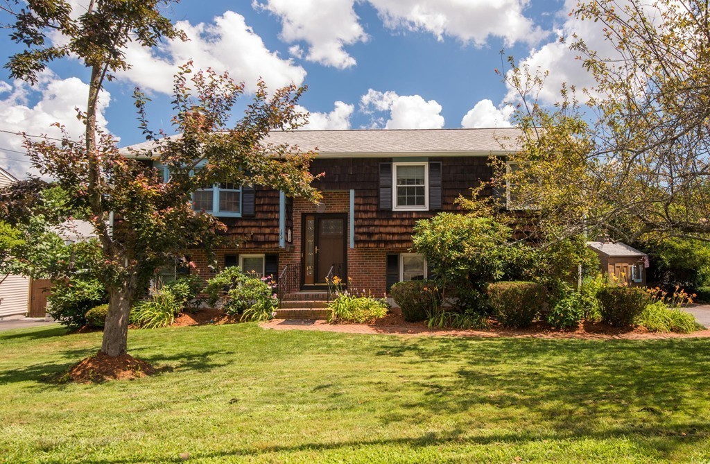 132 Spring Street Stoneham, MA 02180 - Photo 2 of 30 a view of a house with a yard