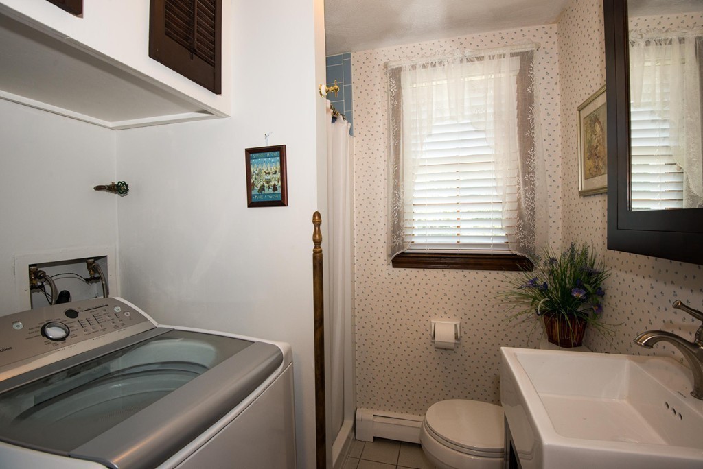 132 Spring Street Stoneham, MA 02180 - Photo 25 of 30 a bathroom with a sink toilet and tub