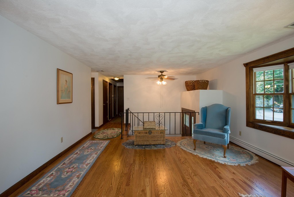 132 Spring Street Stoneham, MA 02180 - Photo 7 of 30 a living room with furniture and a wooden floor