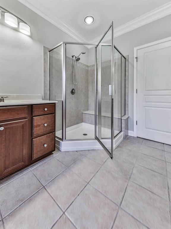 626 Laurel Crossing Canton, GA 30114 - Photo 35 of 77 a bathroom with a shower a sink and a mirror