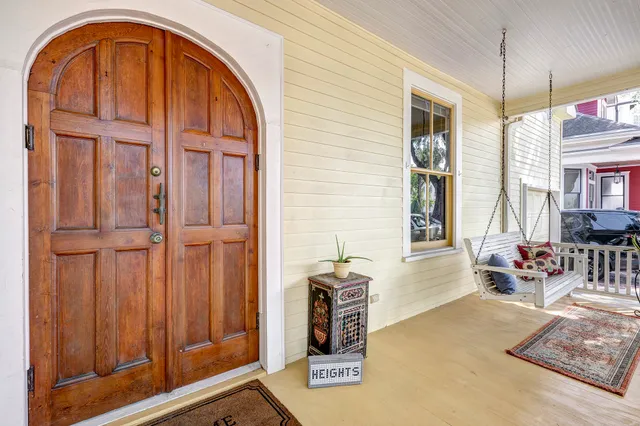 a living room with furniture a dining table and chairs