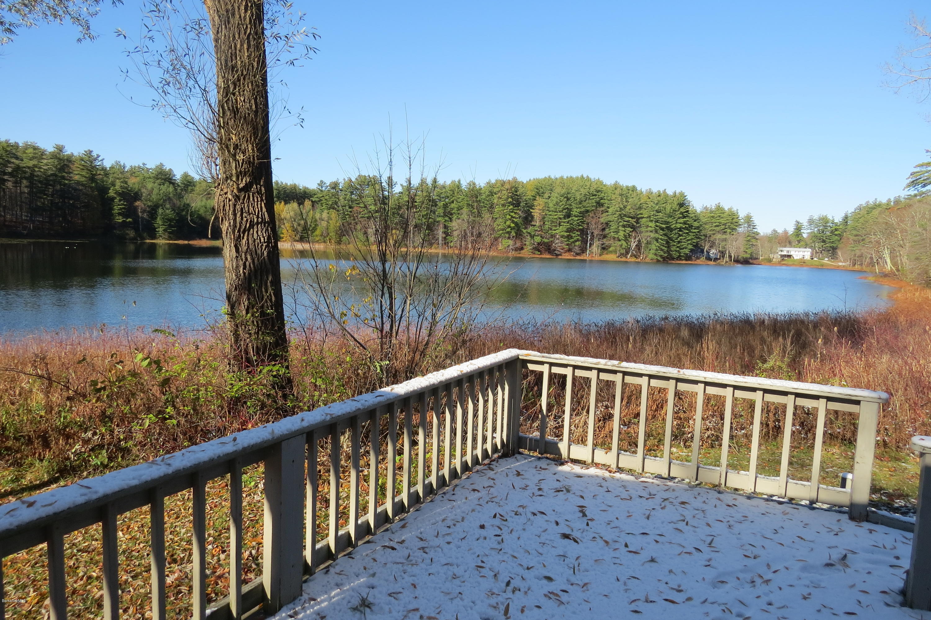 1601 Barber Pond Road Pownal, VT 05261 - Photo 1 of 34 a view of a wooden deck and lake