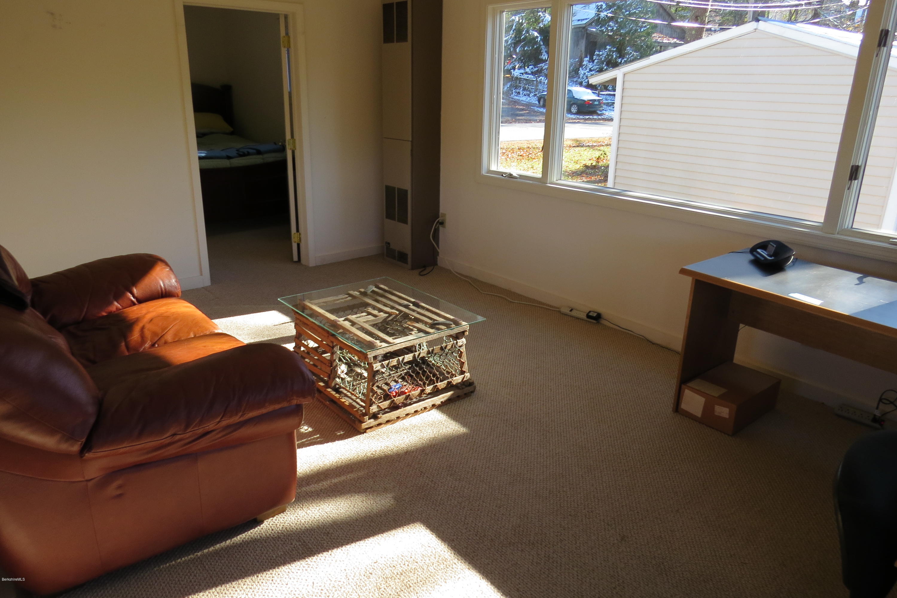 1601 Barber Pond Road Pownal, VT 05261 - Photo 16 of 34 a living room with furniture and a window