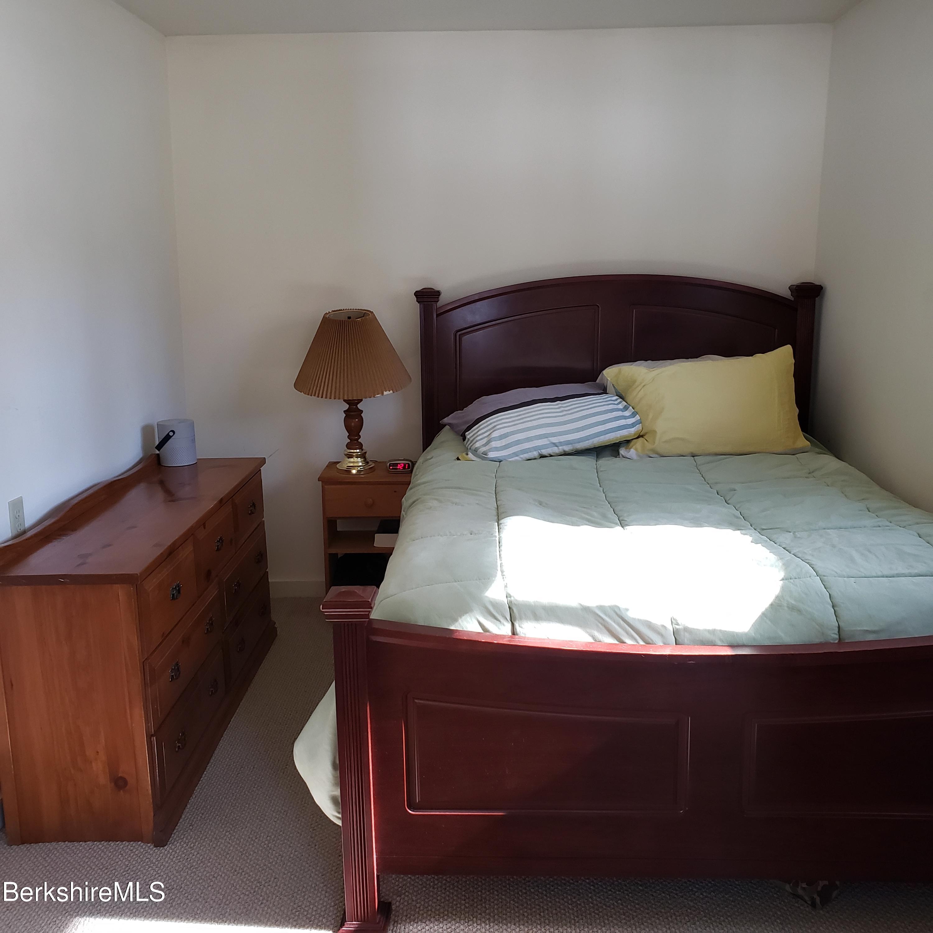 1601 Barber Pond Road Pownal, VT 05261 - Photo 17 of 34 a room with a bed and window