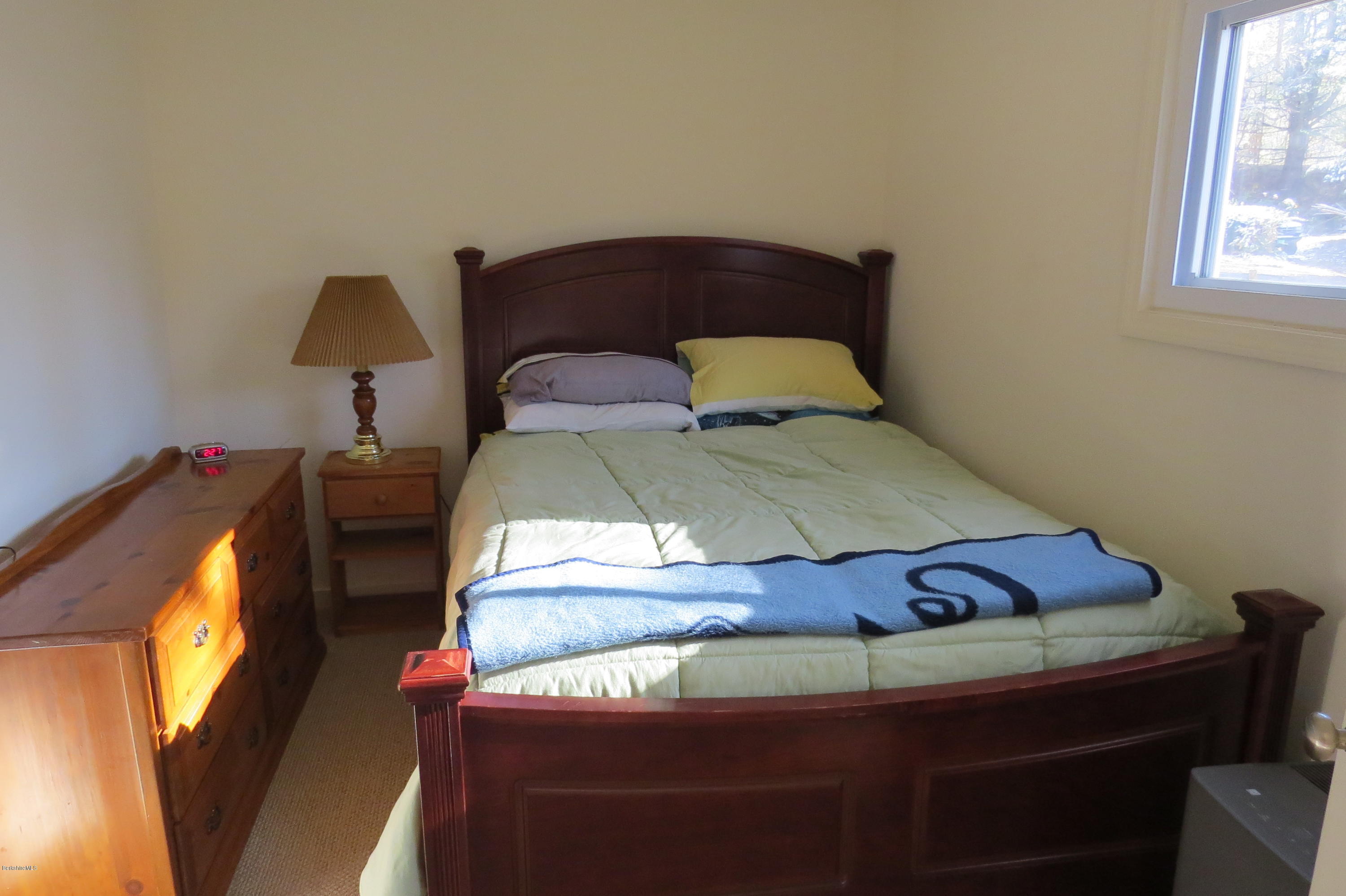 1601 Barber Pond Road Pownal, VT 05261 - Photo 18 of 34 a bedroom with a bed and a window