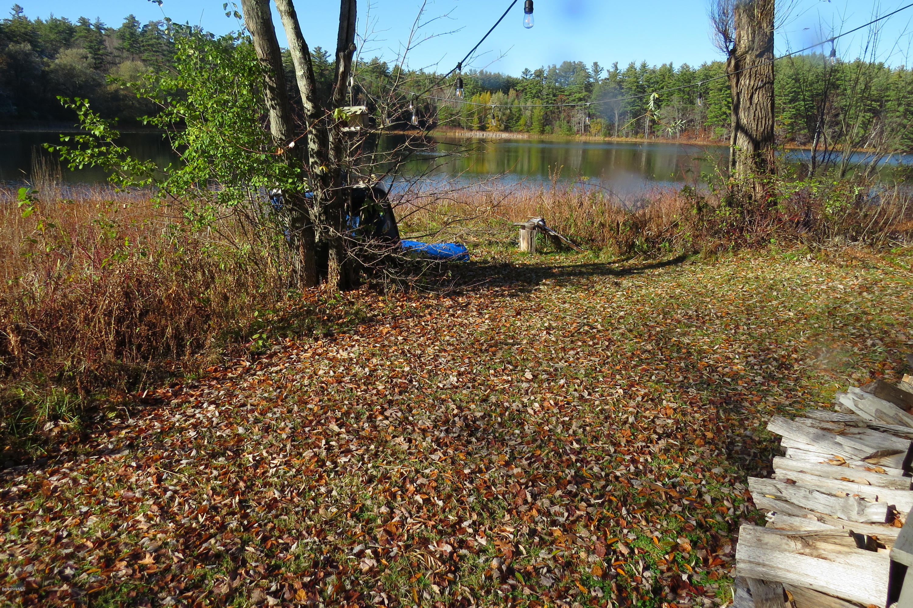 1601 Barber Pond Road Pownal, VT 05261 - Photo 30 of 34 a view of a lake with a house in the background
