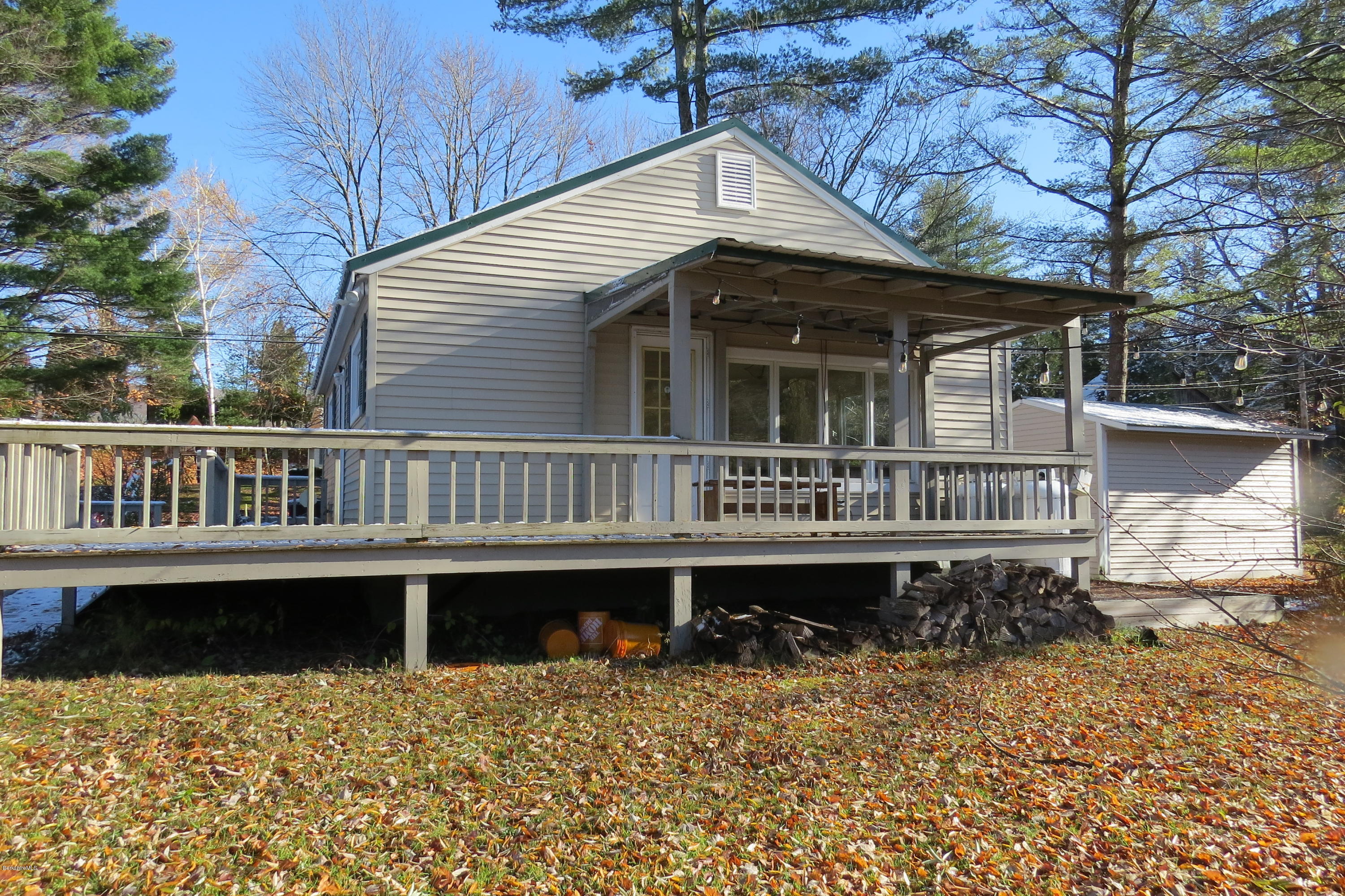 1601 Barber Pond Road Pownal, VT 05261 - Photo 33 of 34 a view of a house with wooden deck and a lake view
