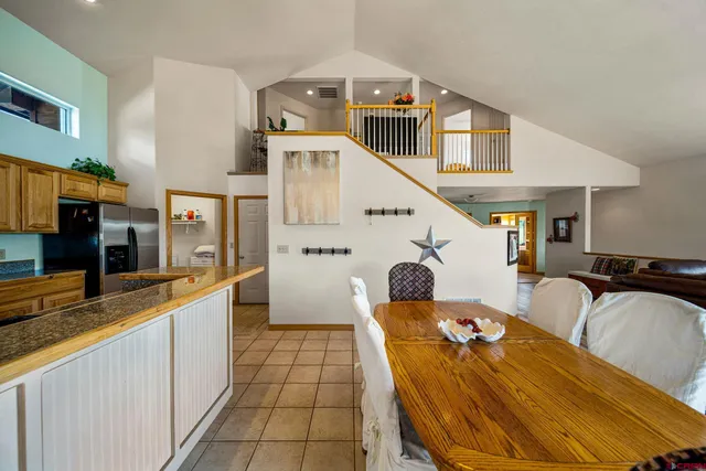 a kitchen with stainless steel appliances kitchen island granite countertop a sink and cabinets