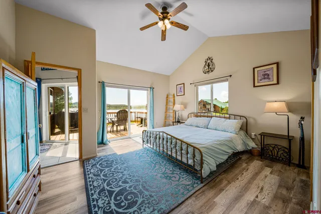 a bathroom with a double vanity sink a mirror a bathtub and shower