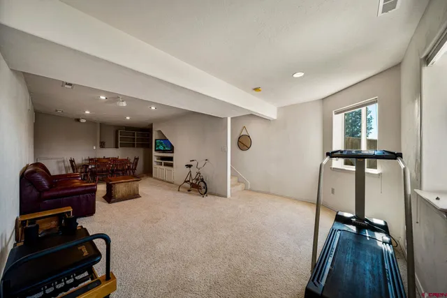 a bedroom with bed and wooden floor