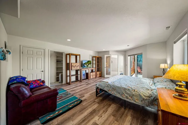 a bathroom with a sink mirror and toilet